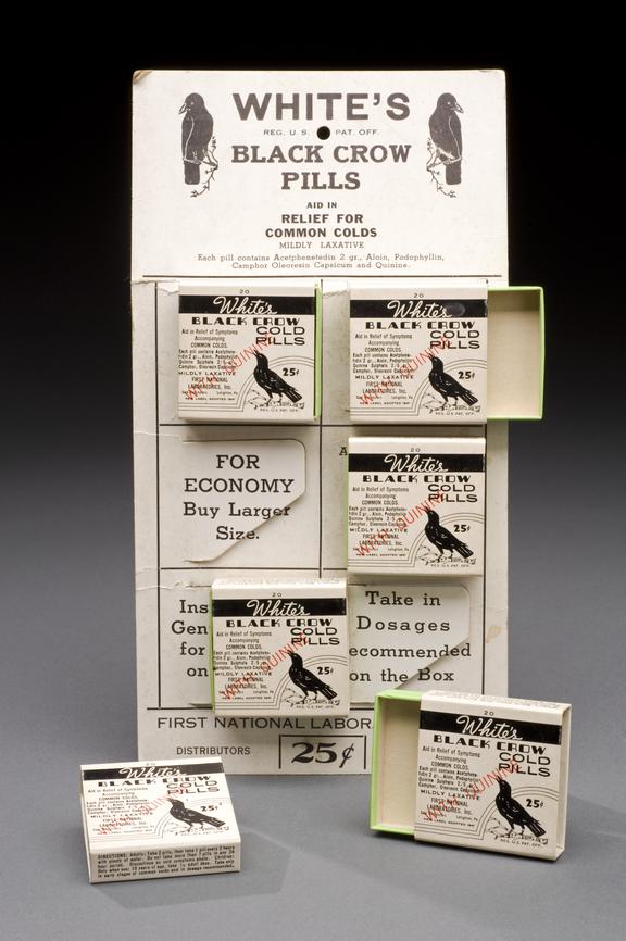 Display card with six boxes of White's Black Crow Cold Pills