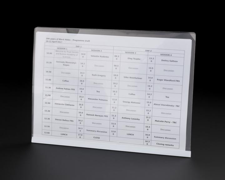 Plastic wallet containing the programme draft and the speaker list for 100 Years of Black Holes