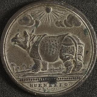 White metal medal to commemorate the exhibition of a rhinoceros in European towns