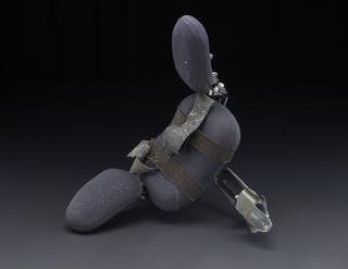 Wheelchair headrest with wing supports and straps