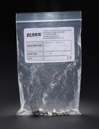 Plastic bag containing screws and squared clamp for a bespoke headrest mount