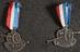 Two lapel badges