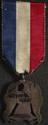 Silver medal with silk ribbon