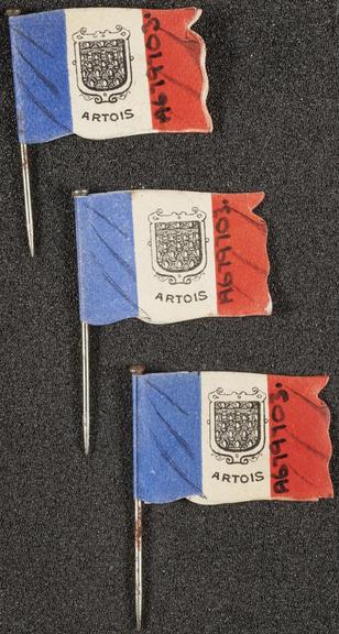 Three lapel badges
