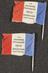 Two lapel badges