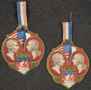 Two lapel badges