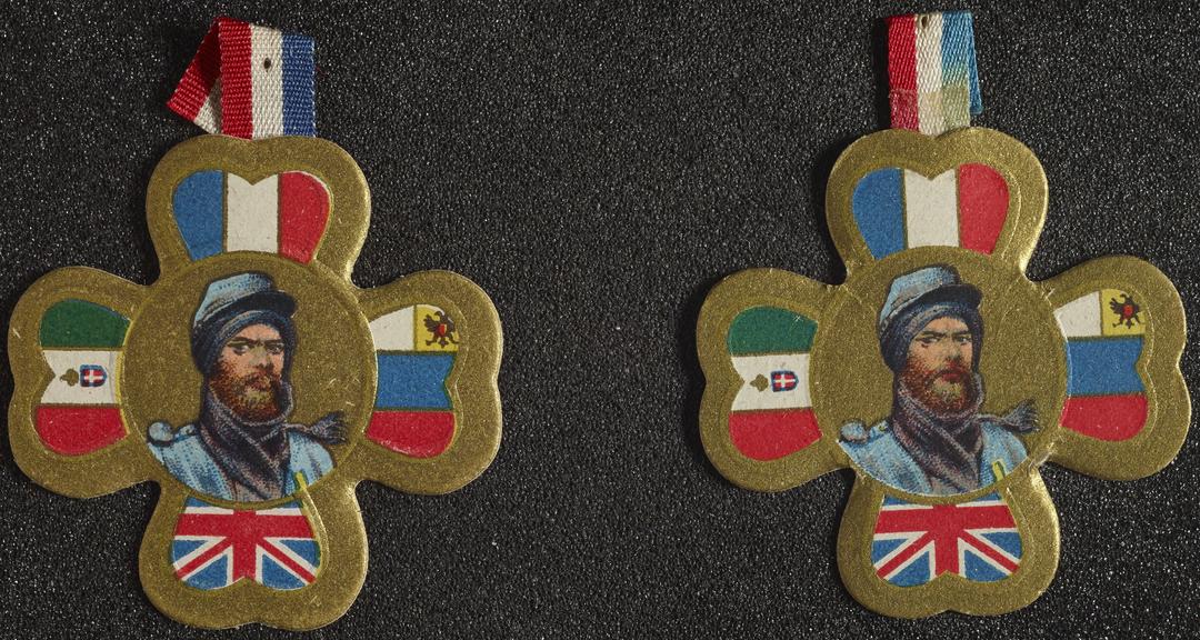 Two lapel badges