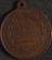 Circular copper medal or token