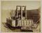 Albumen photograph: dredger in dry dock for damage inspection