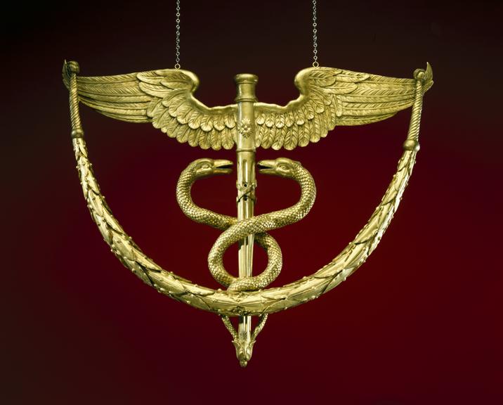 Gilt wood and plaster winged caduceus