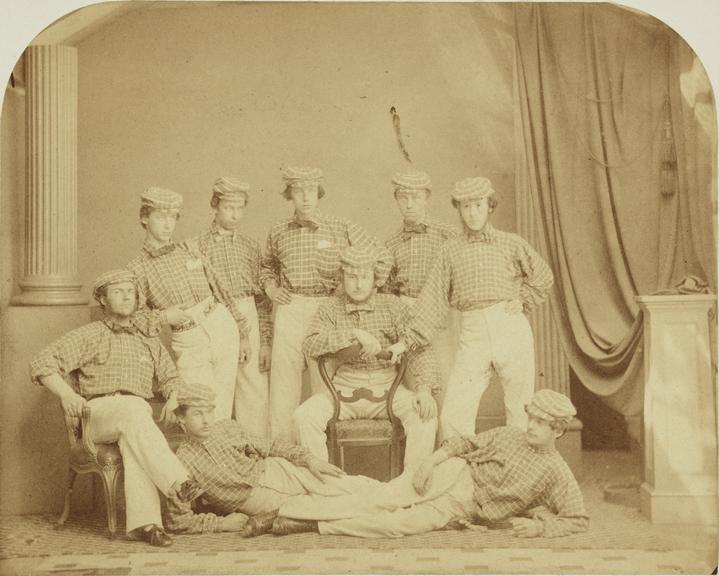 Group photograph of young men in check shirts