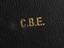 Black presentation box, empty, inscribed 'C.B.E