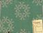 Sample of green furnishing Jacquard-woven linen fabric based on