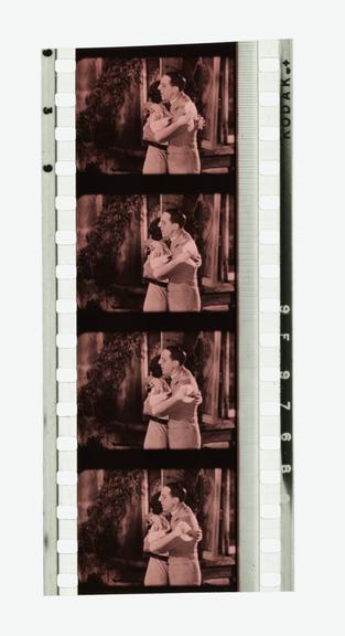 Four frames of 35mm Sonochrome tinted sound positive film with