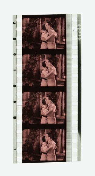 Four frames of 35mm Sonochrome tinted sound positive film with