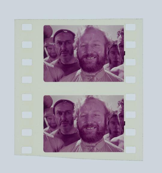 Two frames of silent 35mm positive Technicolor film (with space