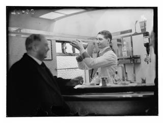 Bartender mixing cocktails aboard the Flying Scotsman