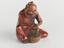 Wooden netsuke in the form of a seated man grinding with a