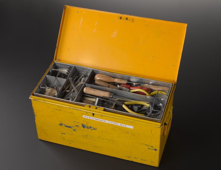 Box containing tools for maintaining Strowger telephone switching equipment, with maintenance engineer’s inspection lamp and portable test telephone