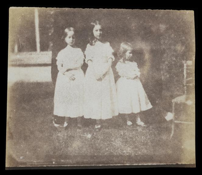 Rosamond, Ela and Matilda Talbot standing in the cloister at Lacock Abbey