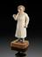 Wooden statue depicting a female doctor holding a stethoscope