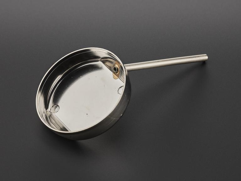 Metal cap with protruding metal rod