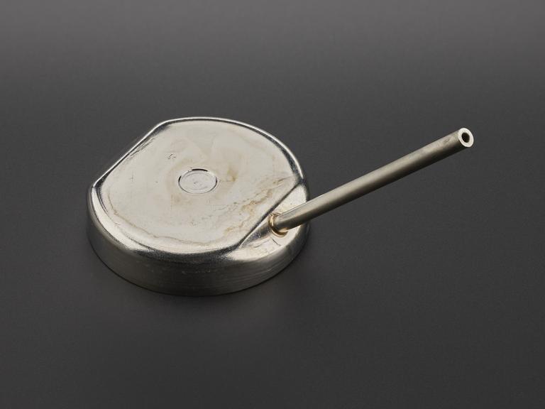 Metal cap with protruding metal rod