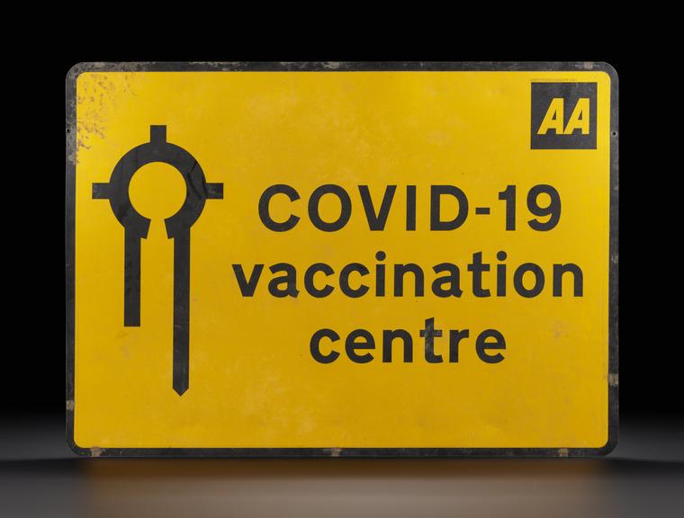 Road sign directing people to their COVID-19 vaccination