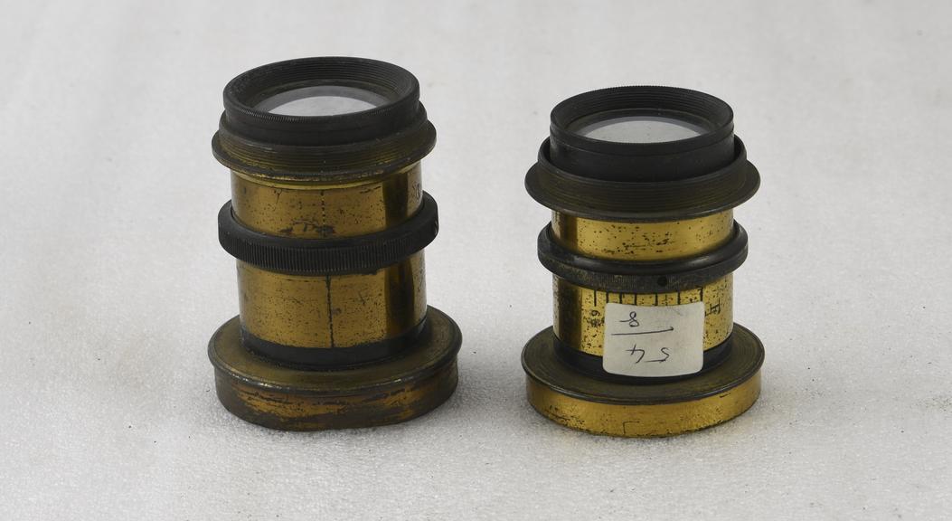 Two brass-mounted lenses.