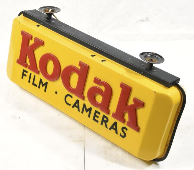 Illuminating Hanging Advertisement 'Kodak, Film, Cameras'