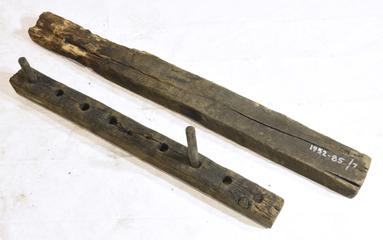 Two Wooden Bars, one with Holes and Two Pegs.
