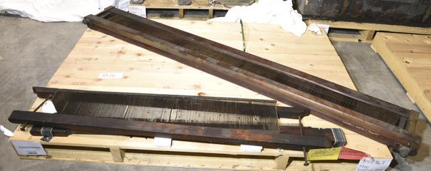 beaming machine parts; long wood rectangular frame with iron grille insert.