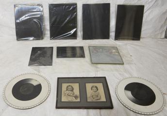 Collection of glass plate negatives, prints, and exposure timers