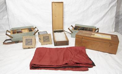 Collection of three cardboard boxes of coloured lantern slides