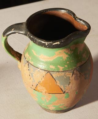 Earthenware jug with lip and handle