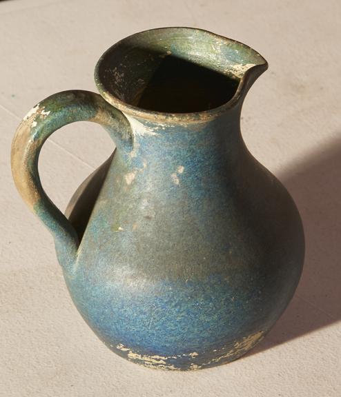 Earthenware jug with handle and lip