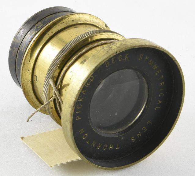 Brass mounted symmetrical lens F.8 11 inch f.l with a ring iris diaphragm