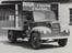 An early milk delivery truck, showing the slogan "Milk