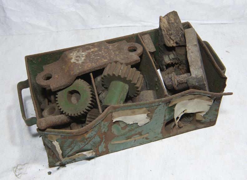 Cogs and Plates in a Compartmented Iron Box