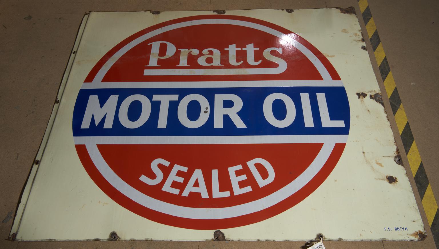 Enamel petrol sign for 'Pratts / Motor Oil / Sealed' with red and blue bands on a cream background