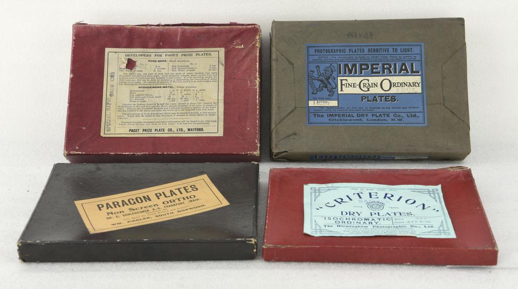 Four boxes of photographic plates.