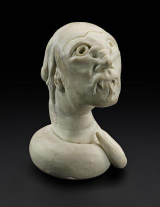 Model head of 'The Reptile'