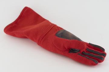 One of a pair of racing driver's gloves as used by Alan Jones
