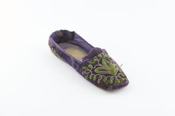 One purple velvet slipper