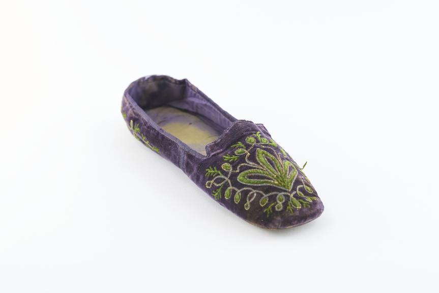 One purple velvet slipper