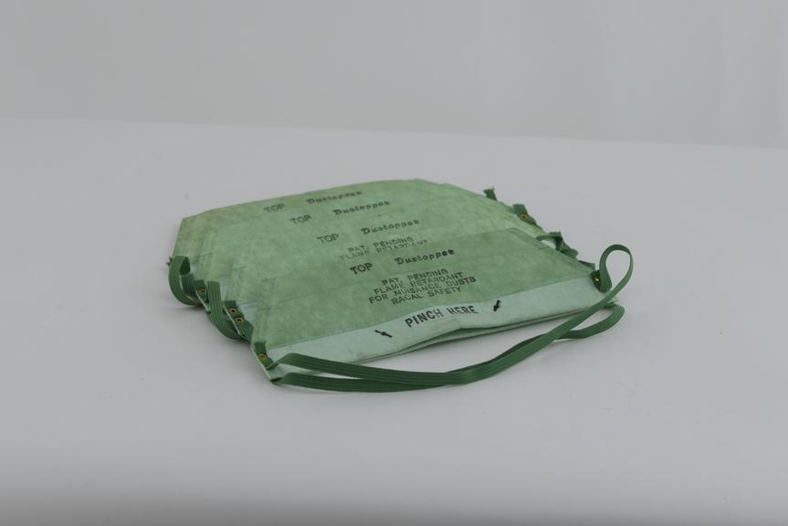 Two disposable folded paper 'Dustopper' dust masks