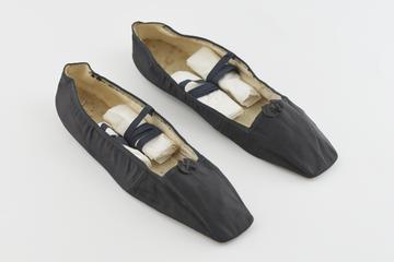 Pair of black silk slippers