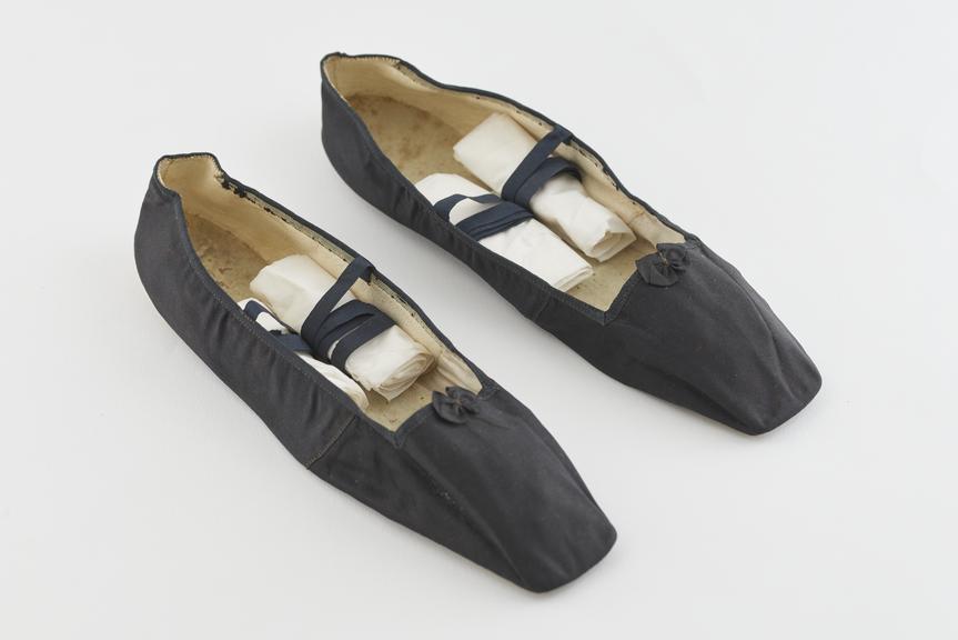 Pair of black silk slippers