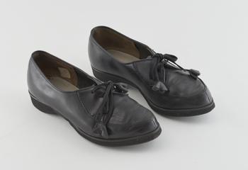 Pair of women's black leather lace-up shoes