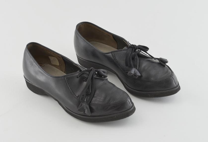 Pair of women's black leather lace-up shoes